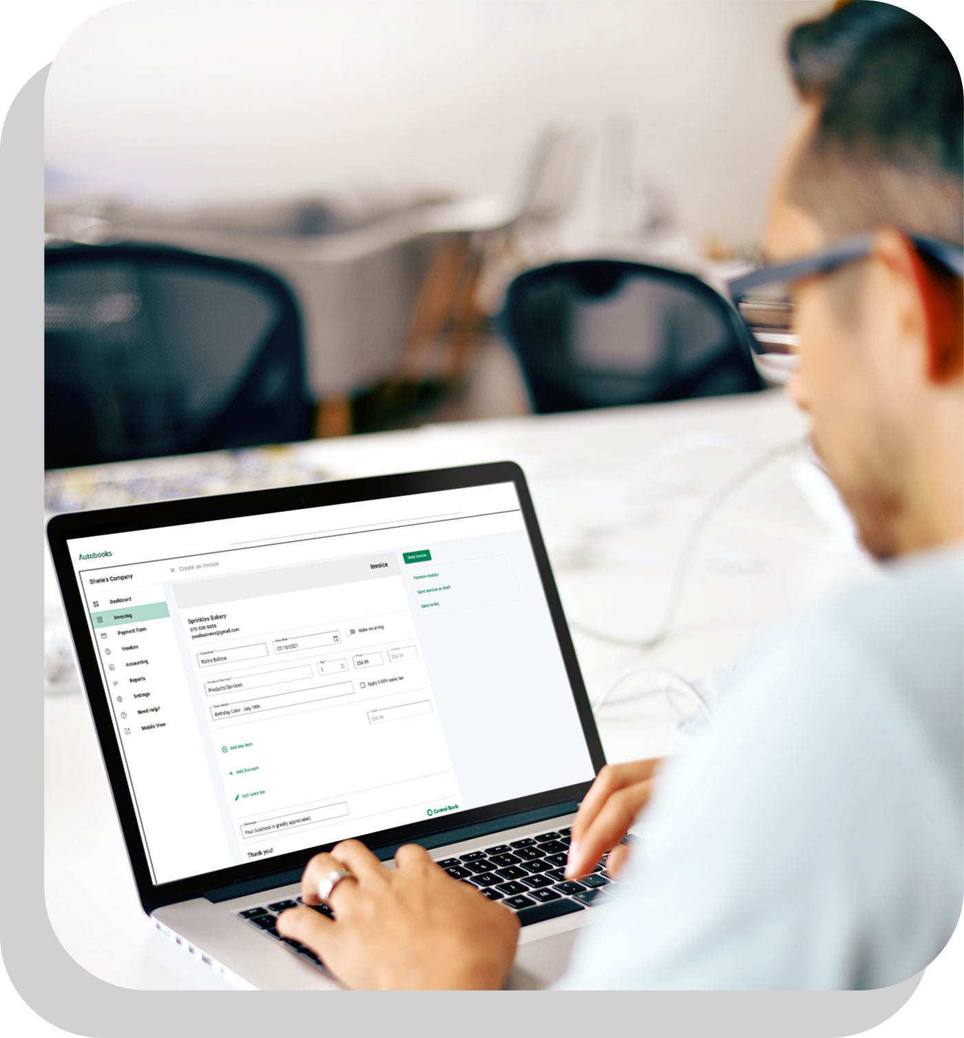 man paying invoice on laptop